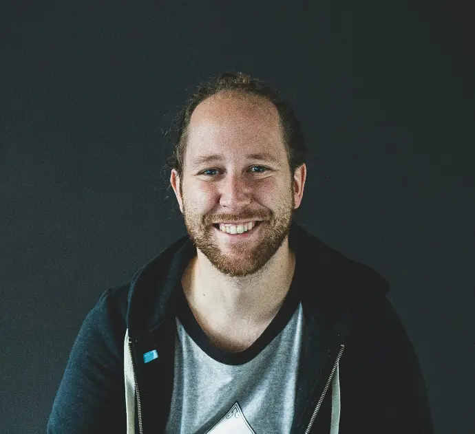 man in black jacket smiling